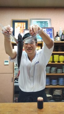 The chef demonstrating how the fish would fly